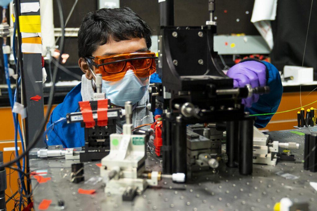 person building a research device.